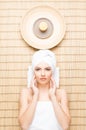 Beautiful, young and healthy woman in spa salon on bamboo mat. S Royalty Free Stock Photo