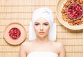 Beautiful, young and healthy woman in spa salon on bamboo mat. S Royalty Free Stock Photo