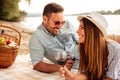 Beautiful young couple enjoying picnic on a beach Royalty Free Stock Photo