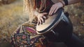 Portrait of an attractive hippie woman with dreadlocks in the woods at sunset having good time outdoorsBeautiful young hippie woma