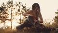 Portrait of an attractive hippie woman with dreadlocks in the woods at sunset having good time outdoorsBeautiful young hippie woma