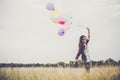 Beautiful young hipster woman holding with colorful of balloons Royalty Free Stock Photo