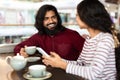 Beautiful young indian couple have romantic date at cafe Royalty Free Stock Photo