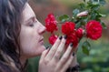 Beautiful young individual, eccentric woman, with attractive dreadlocks, piercing and tattoo, who with eyes closed