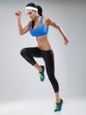 Beautiful young jogging woman. Isolated over white background (colored, retouched)