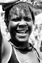 A beautiful young Karamajong woman laughs with abandon in Karamoja, Uganda