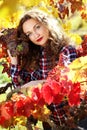 Beautiful young lady in autumn grape vineyard