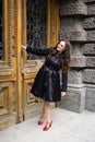 Beautiful young lady in black coat posing Royalty Free Stock Photo