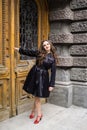 Beautiful young lady in black coat posing Royalty Free Stock Photo