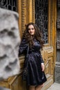 Beautiful young lady in black coat posing Royalty Free Stock Photo