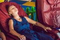 Beautiful young lady relaxing in the massage chair Royalty Free Stock Photo