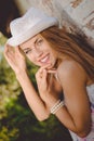 Beautiful young lady in white fedora hat smiling Royalty Free Stock Photo