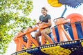 Beautiful, young man having fun at an amusement park Royalty Free Stock Photo