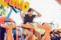 Beautiful, young man having fun at an amusement park Royalty Free Stock Photo