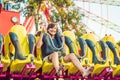 Beautiful, young man having fun at an amusement park Royalty Free Stock Photo