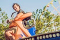 Beautiful, young man having fun at an amusement park Royalty Free Stock Photo