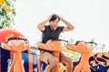 Beautiful, young man having fun at an amusement park Royalty Free Stock Photo