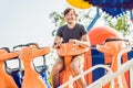 Beautiful, young man having fun at an amusement park Royalty Free Stock Photo