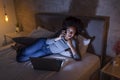 Woman lying in bed and having a phone conversation Royalty Free Stock Photo