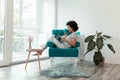 Woman reading a magazine at home Royalty Free Stock Photo