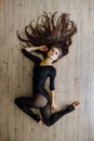 Beautiful young model ballet dancer lying inon floor. Top view. Royalty Free Stock Photo