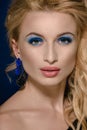 Blonde with blue earrings Royalty Free Stock Photo