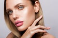 Beautiful young model with pink lips. Nude manicure Royalty Free Stock Photo