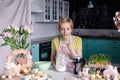 Modern housewife cooks in the kitchen. portrait of a woman cook with mixer. Preparing for Easter Royalty Free Stock Photo