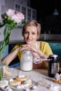 Modern housewife cooks in the kitchen. portrait of a woman cook with mixer. Preparing for Easter Royalty Free Stock Photo