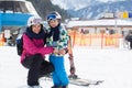 Beautiful young mom and her toddler boy, skiing in the mountains Royalty Free Stock Photo