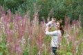 Beautiful young mother with a baby girl in flower field Royalty Free Stock Photo