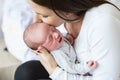 Beautiful young mother with her newborn baby son, bedroom Royalty Free Stock Photo