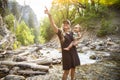 Beautiful young mother and her son playing in nature in the great outdoors