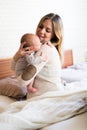 Beautiful young mother holding baby son in her arms Royalty Free Stock Photo