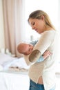 Beautiful young mother holding baby son in her arms Royalty Free Stock Photo