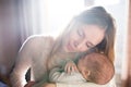 Beautiful young mother holding baby son in her arms Royalty Free Stock Photo