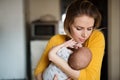 Beautiful young mother holding baby son in her arms Royalty Free Stock Photo