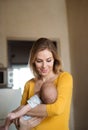 Beautiful young mother holding baby son in her arms Royalty Free Stock Photo