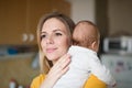 Beautiful young mother holding baby son in her arms Royalty Free Stock Photo