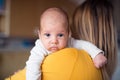 Beautiful young mother holding baby son in her arms Royalty Free Stock Photo