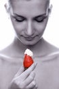 Beautiful young naked girl with red juicy strawberry in her hand Royalty Free Stock Photo