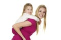 Beautiful Young Nanny Giving a Little Girl a Piggy Back Ride Royalty Free Stock Photo