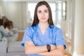 Beautiful young nurse woman wearing uniform and stethoscope at the clinic skeptic and nervous, disapproving expression on face Royalty Free Stock Photo