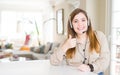 Beautiful young operator woman wearing headset at the office doing happy thumbs up gesture with hand Royalty Free Stock Photo