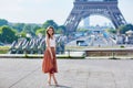 Beautiful young Parisian woman near the Eiffel tower Royalty Free Stock Photo