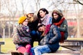 Beautiful young people sitting together in the park Royalty Free Stock Photo