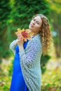 Plussize model in the autumn park