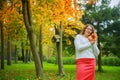 Plussize model in the autumn park