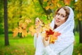 Beautiful young plussize model in the autumn park