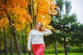 Plussize model in the autumn park